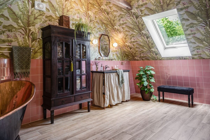 attic-bathroom-pink-tiles-copper-bath-wallpaper-skylight-nordroom