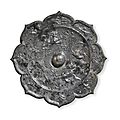 A silvery bronze petal-lobed mirror China, Tang dynasty (AD 618-907)