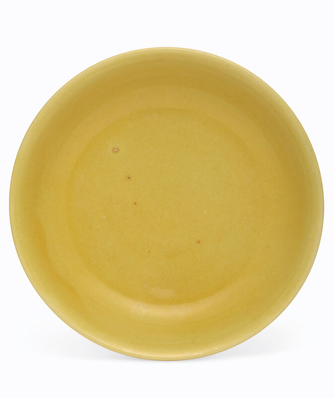 A yellow-glazed dish, Jiajing six-character mark in underglaze blue within a double circle and of the period (1522-1566)