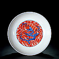 An iron-red and underglaze-blue ‘dragon and waves’ saucer dish, yongzheng period, 1723-1735