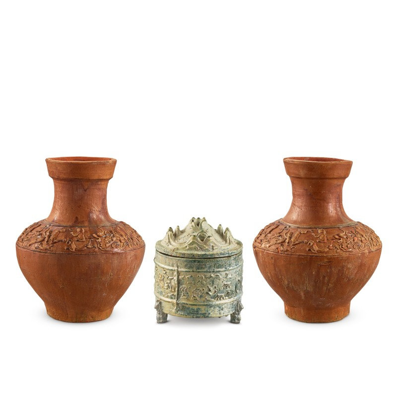 A green-glazed incense burner, Boshan lu, and a pair of brown-glazed 'hunting scene' jars, Eastern Han dynasty