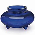 A transparent blue glass tripod incense burner, Qianlong four-character wheel-cut mark within a square and of the period (1736-1795)