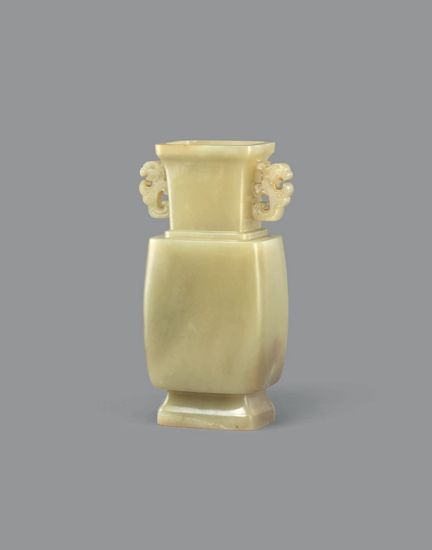 A rare and finely carved yellow jade twin-handled vase, Qianlong period (1736-1795)