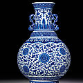 A rare large blue and white moulded vase with ruyi-shaped handles, qianlong six-character seal mark and of the period (1736-1795