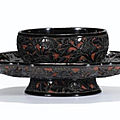 A rare carved 'chrysanthemum' black lacquer cup stand, song dynasty (960-1279)