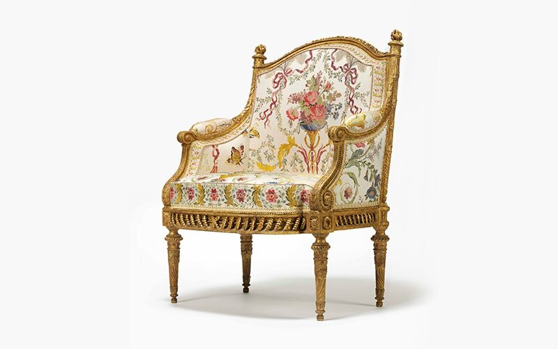 A Louis XV gilt-wood salon suite comprising four armchairs and a