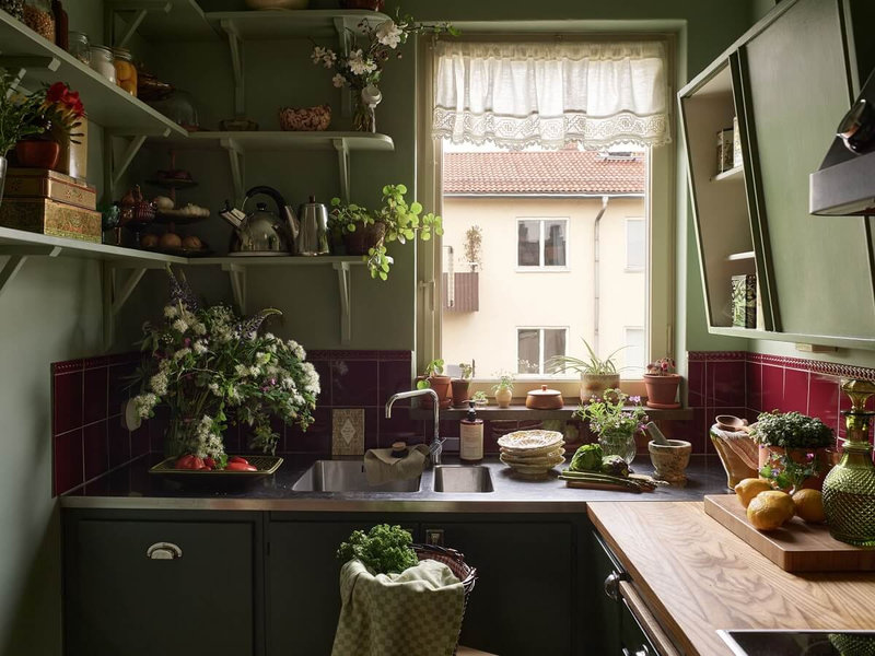 burgundy-tiles-green-kitchen-shelves