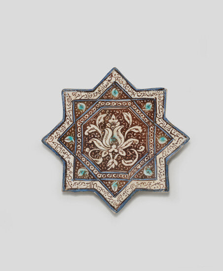 A Kashan lustre pottery star tile, Persia 13th-14th Century
