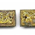A pair of gilt-bronze rectangular belt plaques, north china, 3rd-2nd century ad