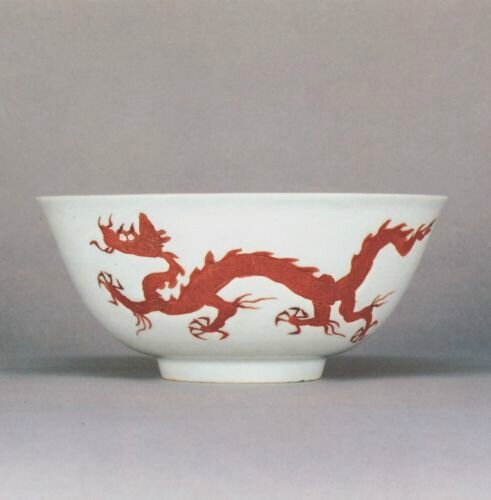 An extremely rare iron-red enamelled 'Dragon' bowl, Hongzhi mark and period (1488-1505) sold at Sotheby’s Hong Kong, 16th April 1989, lot 26