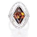 18 karat white gold, fancy deep brown-orange diamond, diamond and rock crystal ring 