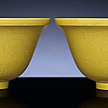 A fine pair of yellow-enamelled incised-decorated 'dragon' bowls, qianlong six-character sealmarks and of the period (1736-1795)