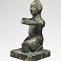 A very rare bronze figural support, warring states period, 5th-3rd century bc