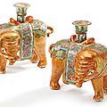 A pair of chinese export porcelain canton famille-rose 'elephant ' candlesticks, mid 19th century
