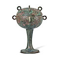 An archaic bronze ritual food vessel and cover, dou, warring states period (475-221 bc)