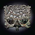  a rare bronze openwork taotie mask fitting, northern wei dynasty, 5th century 