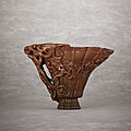A rare and superbly carved rhinoceros horn libation cup, Late Ming-early Qing dynasty, 17th century