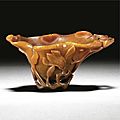 A rhinoceros horn 'magnolia' libation cup, qing dynasty, 18th century