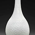 A white-glazed relief-decorated pear-shaped vase, 18th century