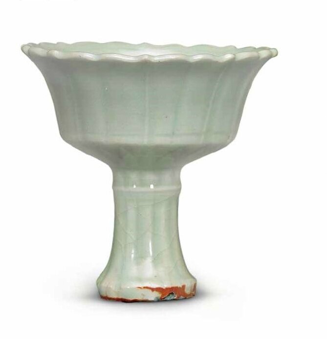 A carved Longquan celadon barbed rim oil lamp, Late Yuan-Early Ming dynasty, 14th century