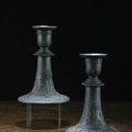 A pair of wedgwood basalt candle holders, circa 1800