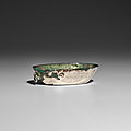 A small oval silver cup with ring handle, tang dynasty (618-907)