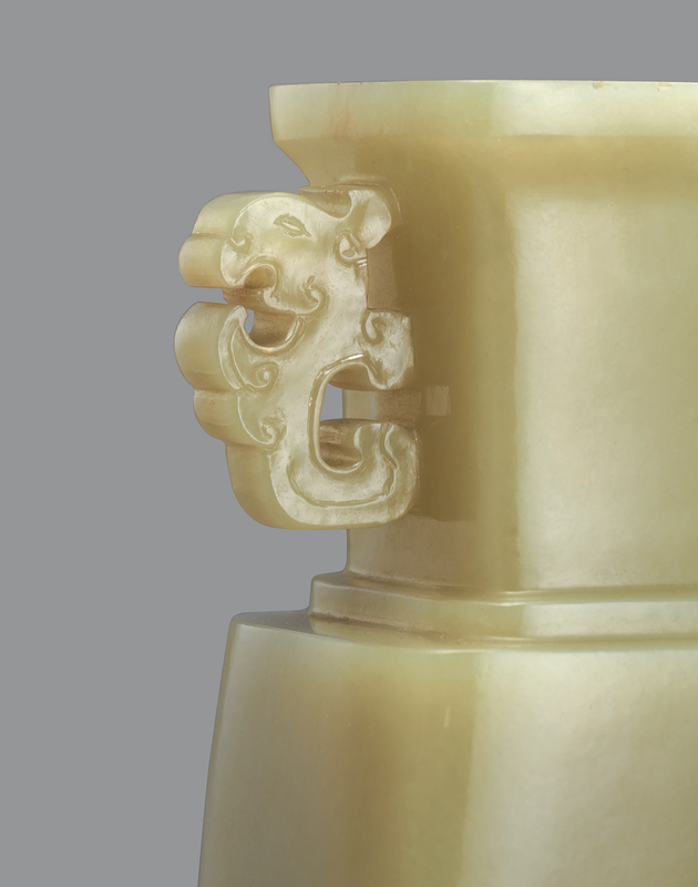 A rare and finely carved yellow jade twin-handled vase, Qianlong period (1736-1795) detail