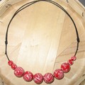 Collier perles rouges...