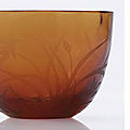 A very rare Imperial wheel-engraved translucent amber glass wine cup, Qianlong engraved four-character mark within a square and of the period (1736-1795)