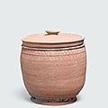 An unglazed stoneware storage jar and lid, Lý–Trần dynasty, 12th-14th century