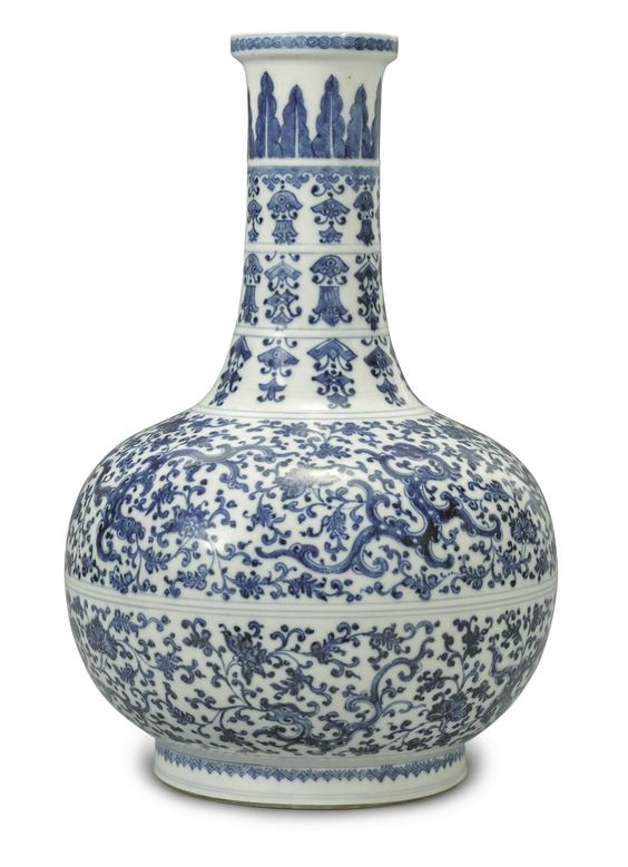 A soft paste blue and white 'Phoenix and Kuilong' bottle vase, Qing dynasty, Yongzheng period (1723-1735)