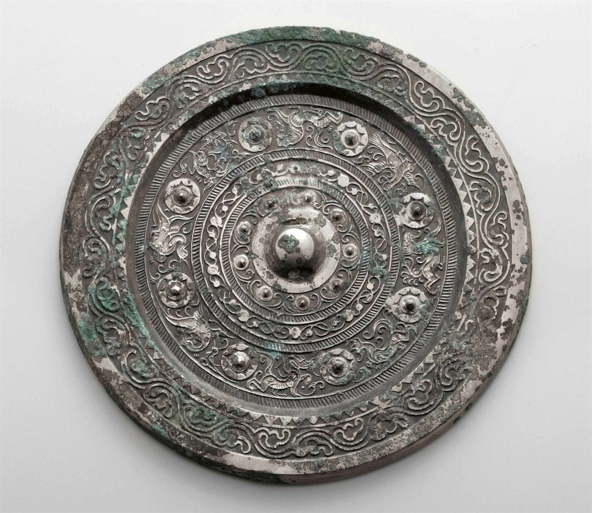 A silvery bronze circular mirror, Han Dynasty (206 BC-AD 220)