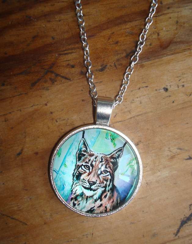Bijou femelle lynx Ghislaine Letourneur 2 -BD - Diamètre 2,7 cm chaîne argentée Cabochon verre