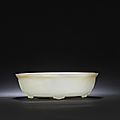 A white and russet jade 'twin-fish and bajixiang' 'marriage' bowl, qianlong period (1736-1795)