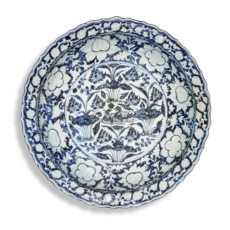 A rare large blue and white moulded 'mandarin duck and lotus pond' dish, Yuan dynasty