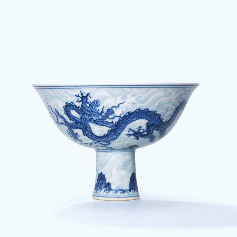 An extremely rare and superbly painted anhua-decorated blue and white ‘dragon’ stem bowl, Xuande six-character mark in underglaze blue within a double circle and of the period (1426-1435)