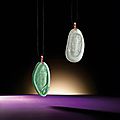 Fine pair of icy jadeite 'guanyin' pendants