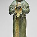 A sancai-glazed pottery figure of an attendant, tang dynasty
