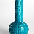 A deep cut turquoise-blue Beijing glass 'Dragon' bottle vase, engraved Qianlong four-character mark, 18th-19th century