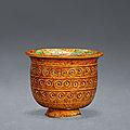 A yellow and green-glazed cup, Tang dynasty (618-907)