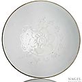 A molded white-glazed porcelain bowl, China, probably Dehua or Huzhou ware, Yuan dynasty