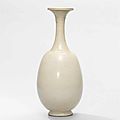 A very rare white-glazed bottle vase and cover, Tang dynasty (618-907)