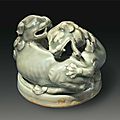 A Yaozhou celadon censer cover in the form of two entwined lions, China, Northern Song-Jin Dynasty, 12th-13th century